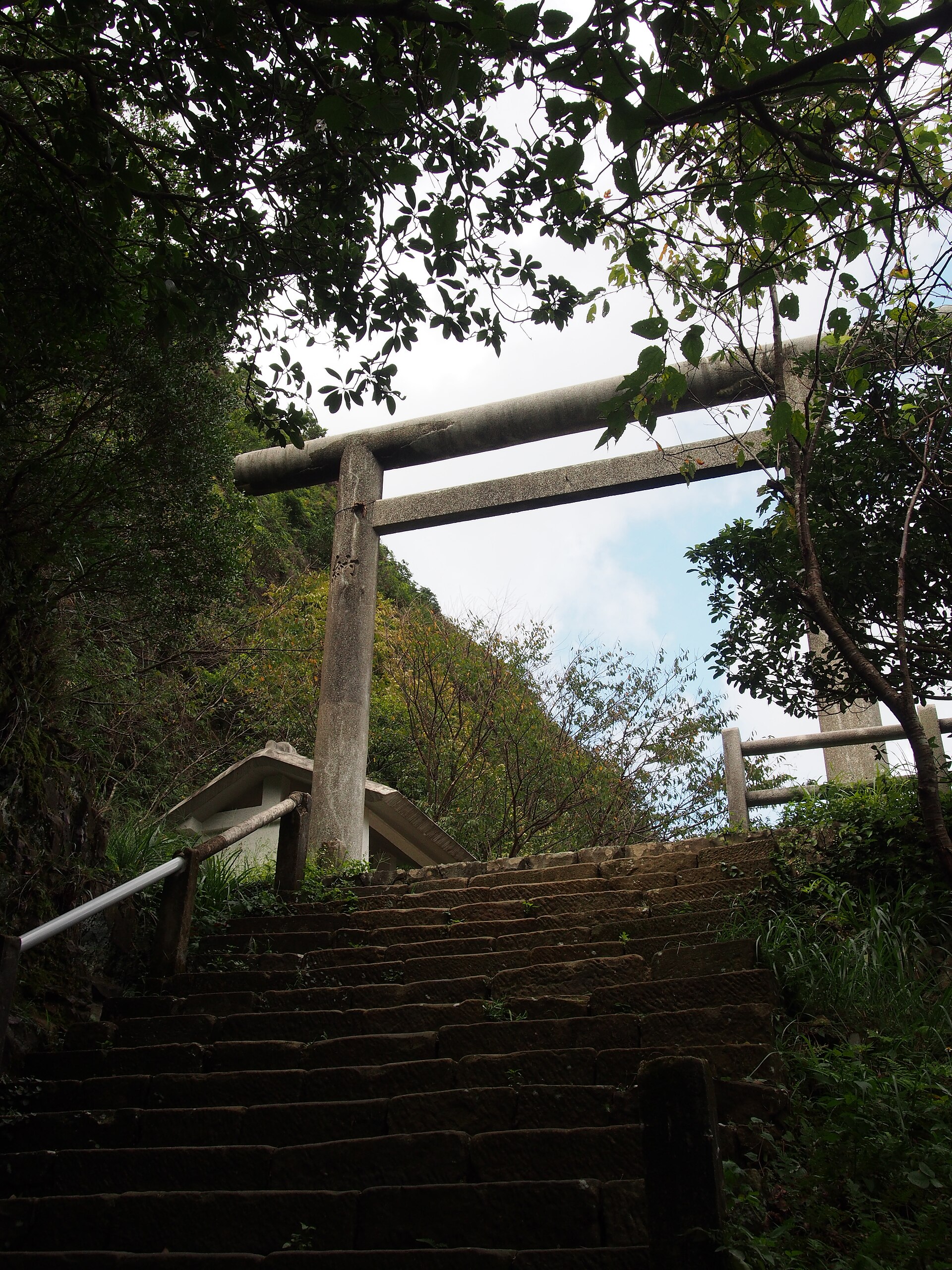 Torii gate and steps of the ruined Ōgon Shrine